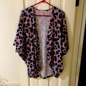 Purchased from Kaley Jase Boutique, fits like a medium. Excellent condition